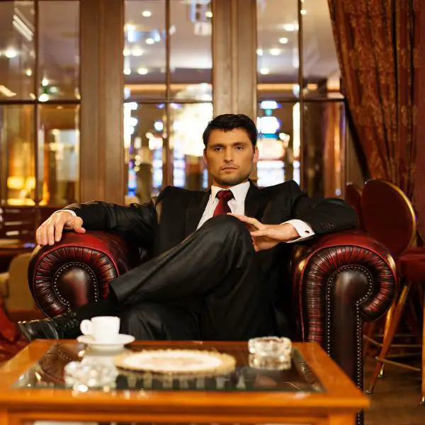 A high value man sitting in lounge