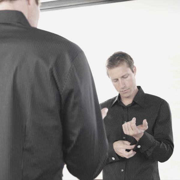 Guy getting dressed for a date