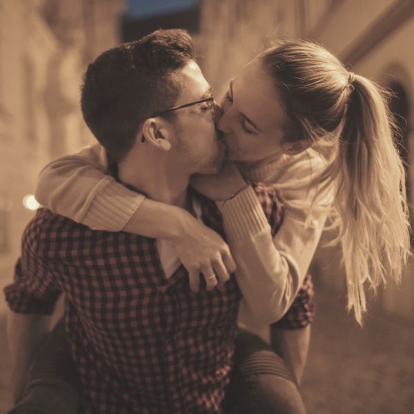 Guy kissing his girlfriend