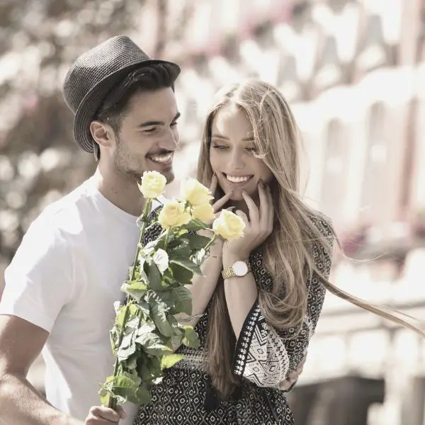 Guy with first date jitters bringing date flowers