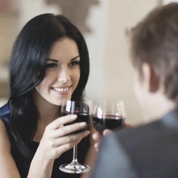Woman enjoying herself on first date with nervous guy