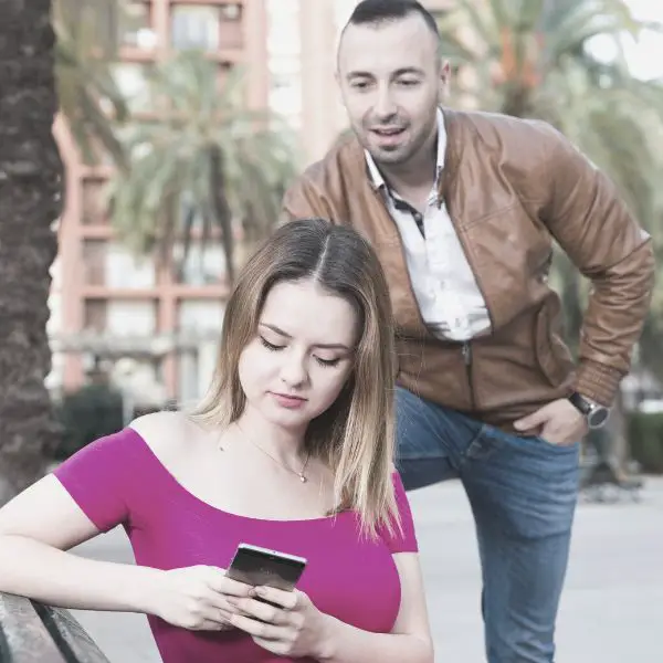 Woman ignoring guy while on phone