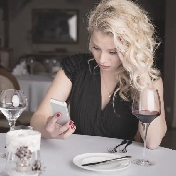 woman texting on a date