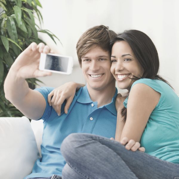 Couple taking a selfie together smiling