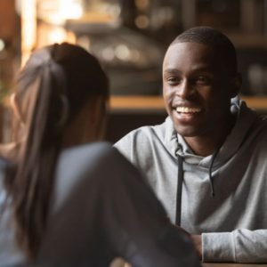 guy smiling while talking to a girl