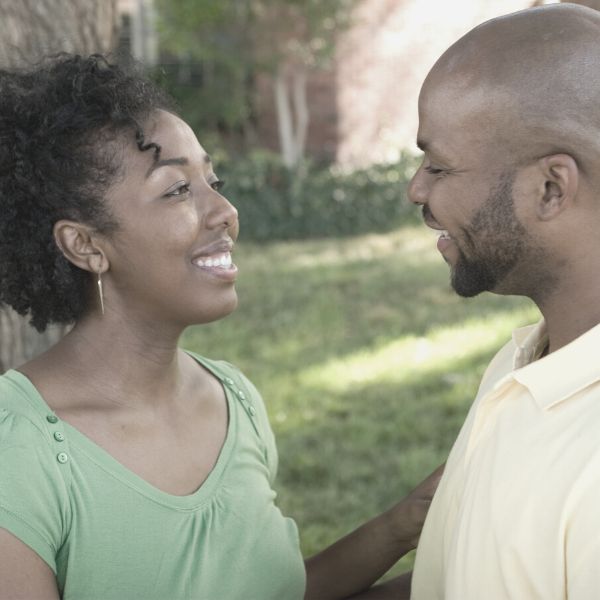 Man and woman smiling at each other