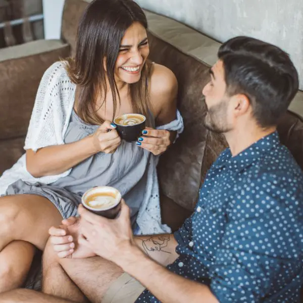 Man asking a woman for a second date while having coffee on first date
