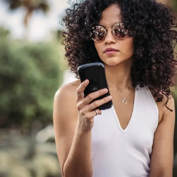 Beautiful woman uninterested in a text from a guy