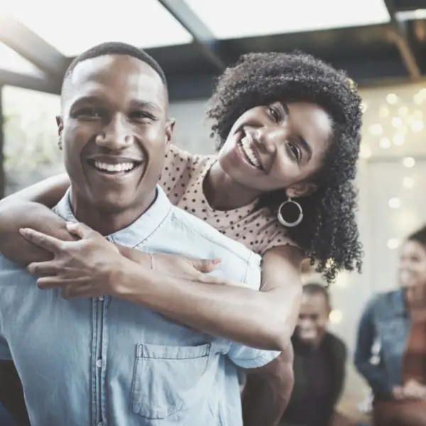 Girl hugging a guy smiling