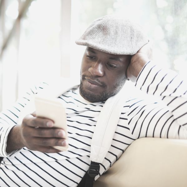 Guy reading a text from a girl