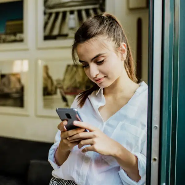 Woman reading a text from a guy