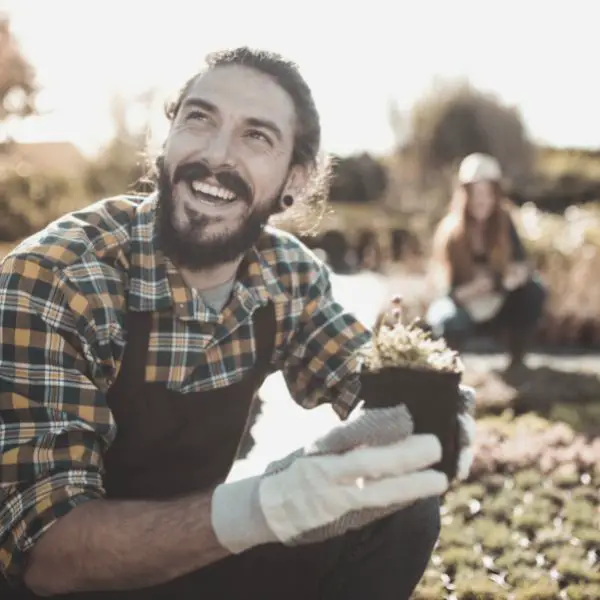 man happy gardening