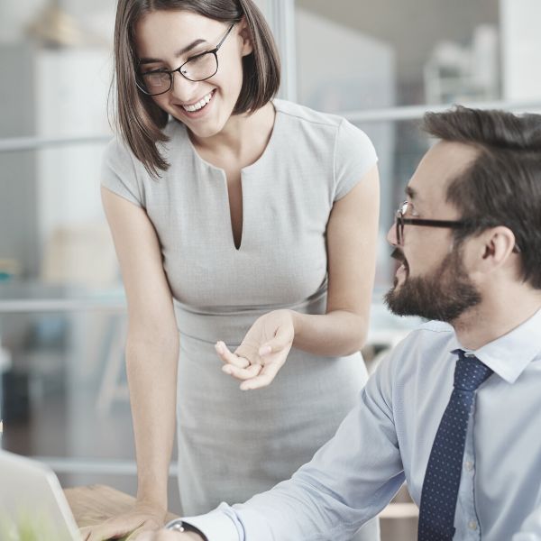 Beta male helping a woman at work