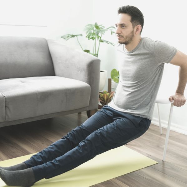 Guy taking action and working out at home