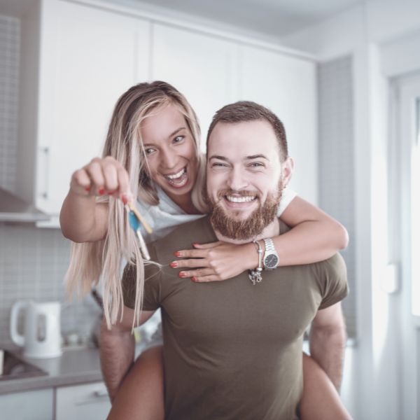 Boyfriend and girlfriend celebrating their new place together